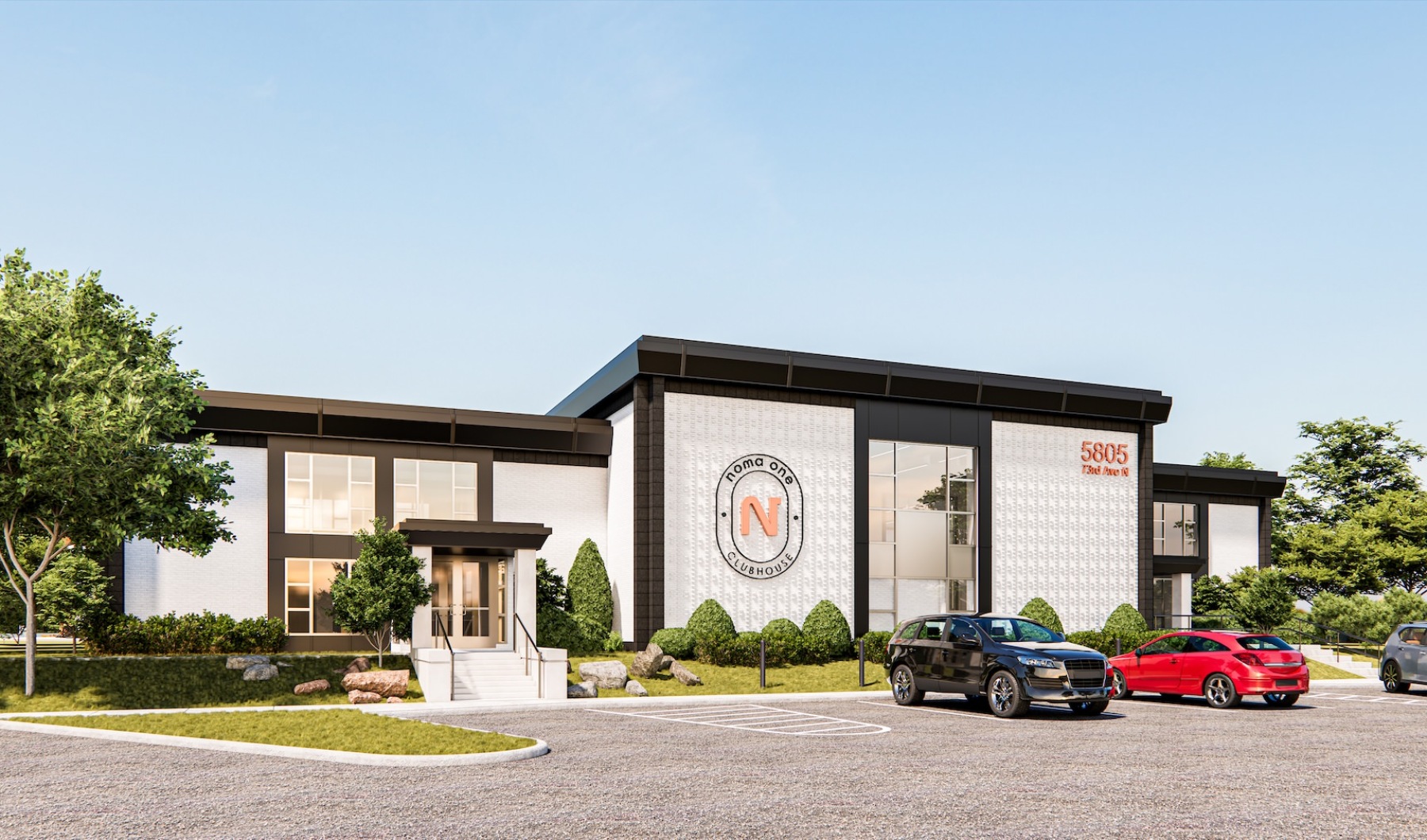 a clubhouse with a parking lot with cars