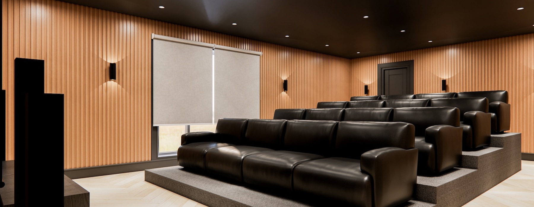a theater room with lounge recliners
